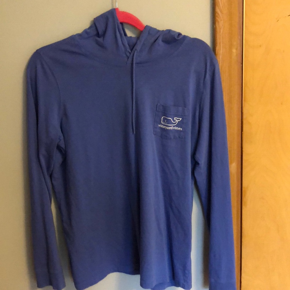 A light long sleeve sweater with a hoodie.